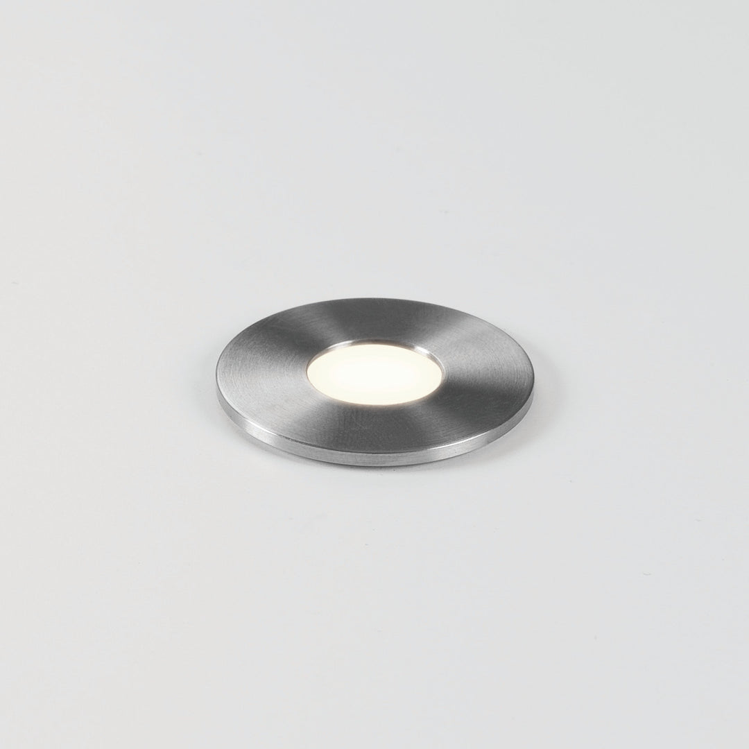 Astro Terra Round 28 LED ground light in brushed stainless steel flush-mounted into paving