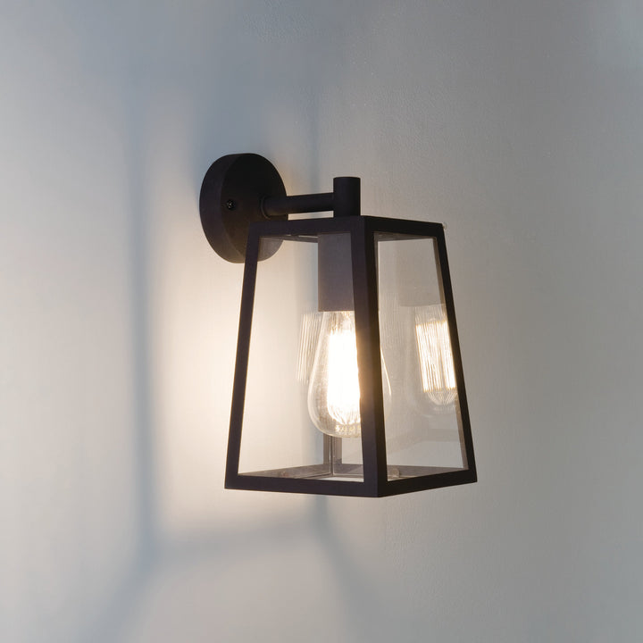 Astro Calvi Wall 215 exterior wall light in Textured Black and Antique Brass with clear glass panels