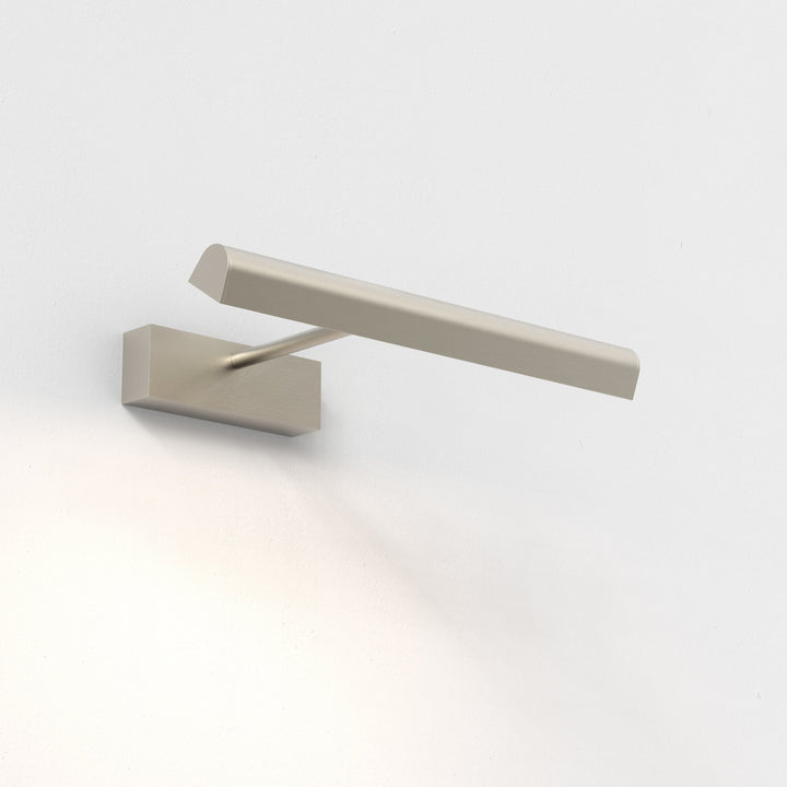 Close-up showing tilting LED diffuser against wall surface