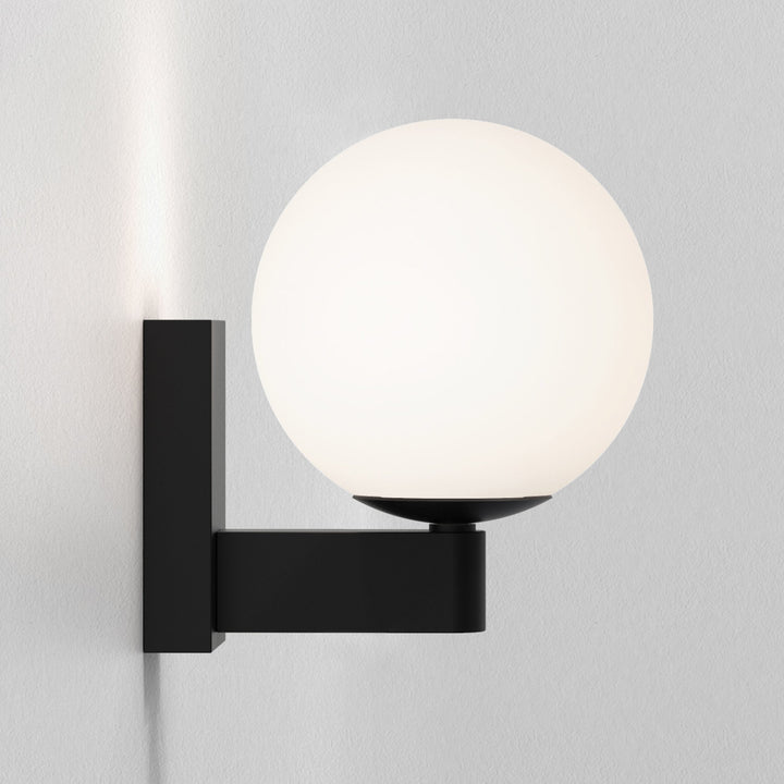 Close-up of the opal glass globe and zinc arm profile