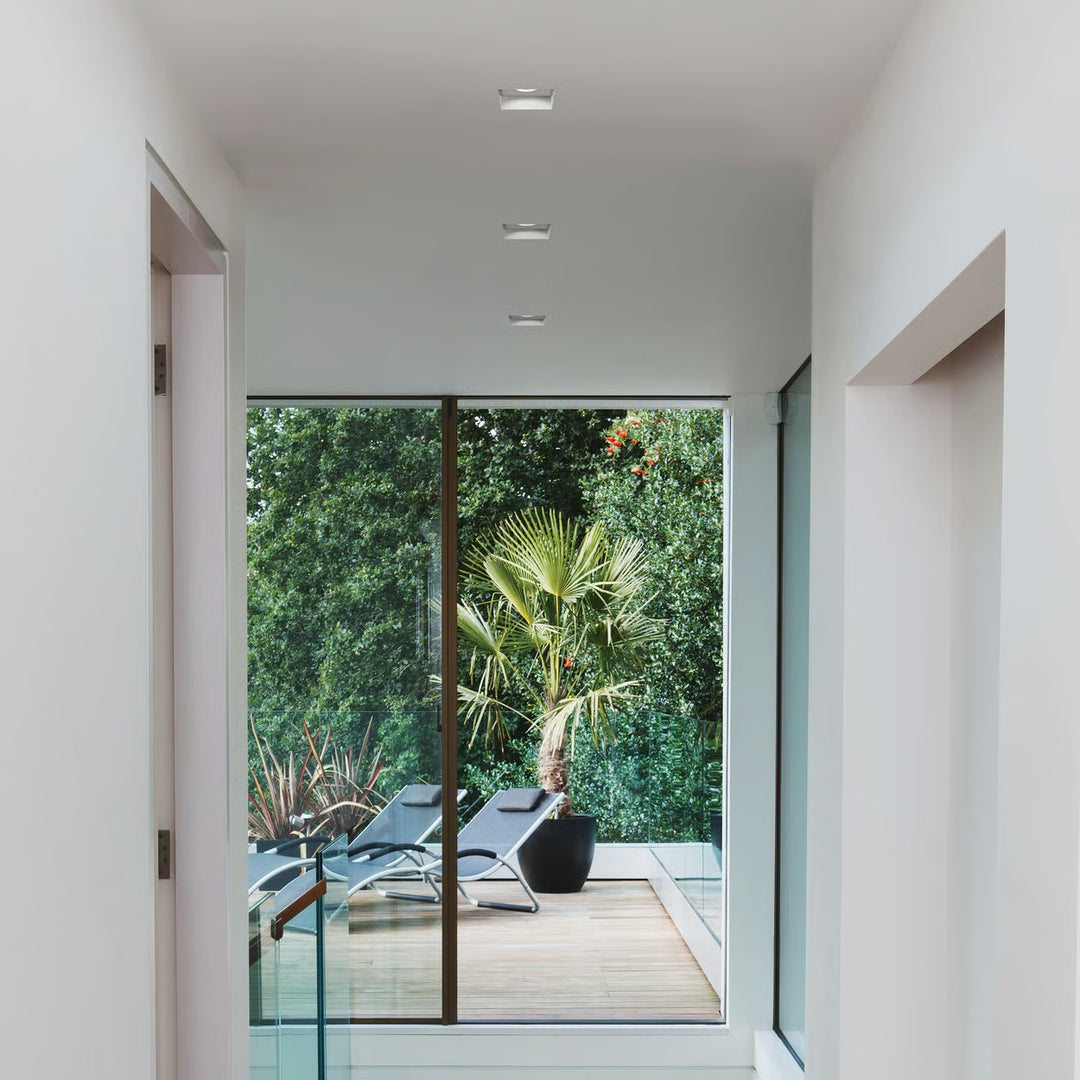 Installed downlight in a bathroom ceiling (wet-zone compatibility)