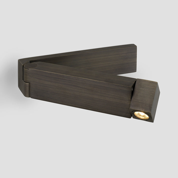 Bronze finish Tosca LED reading wall light casting directed light