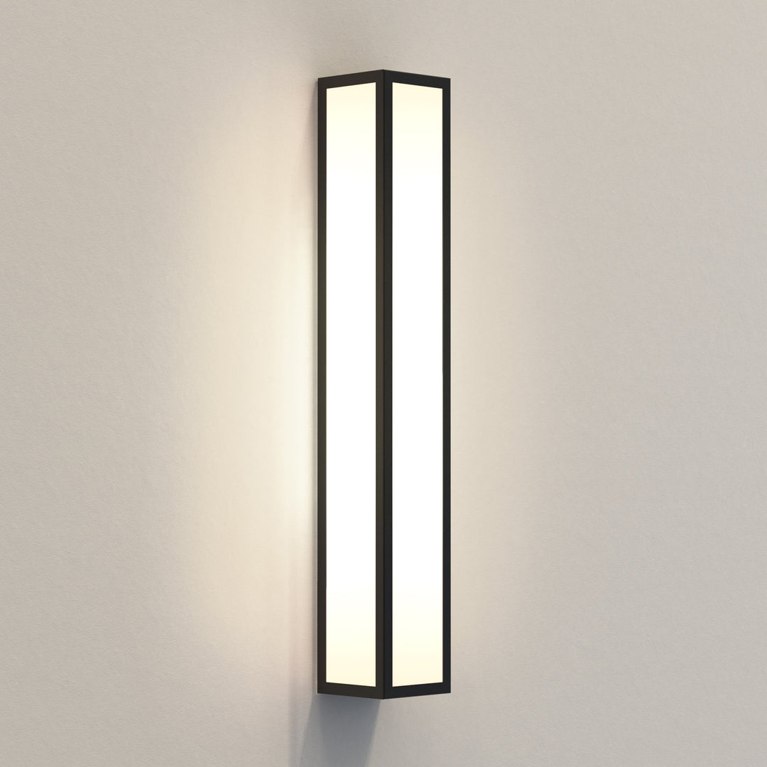 Astro Salerno 520 LED wall light in textured black, frosted glass panels, vertical orientation