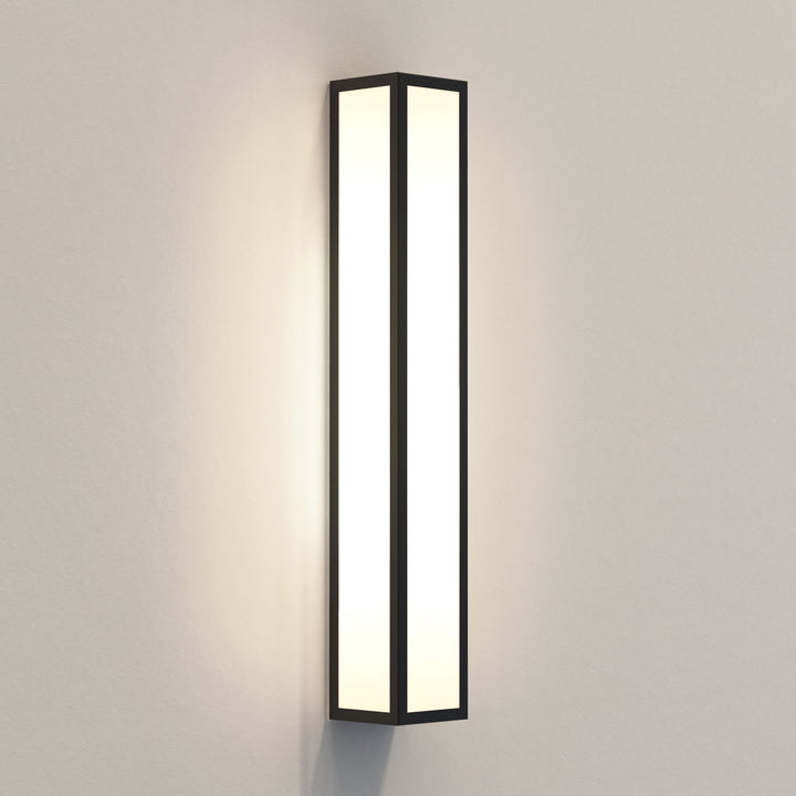 Astro Salerno 520 LED wall light in textured black, frosted glass panels, vertical orientation