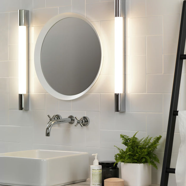 Palermo 600 LED installed on a bathroom wall, softly illuminating alongside a mirror