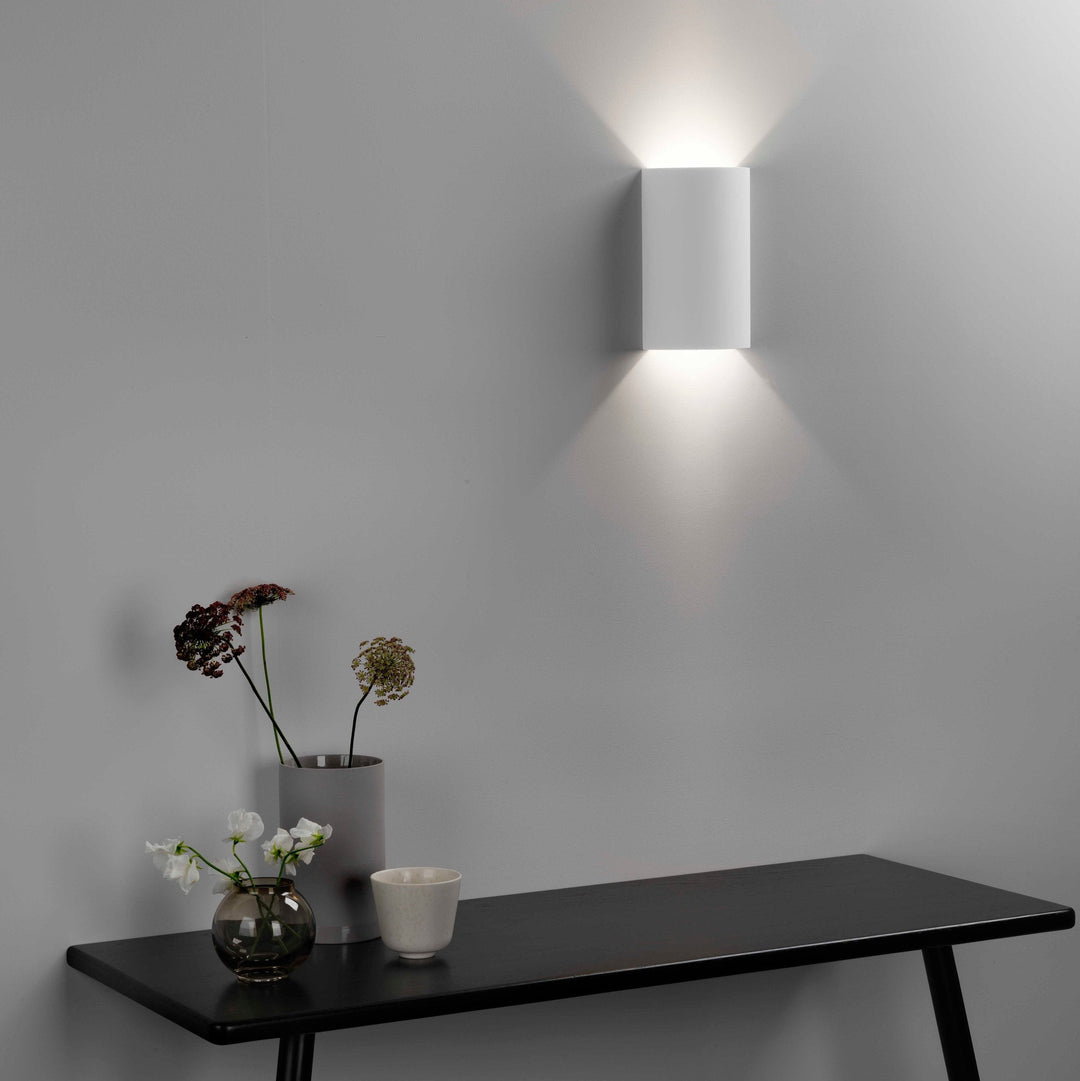 Astro Serifos 220 plaster wall light—soft light cast above and below on wall