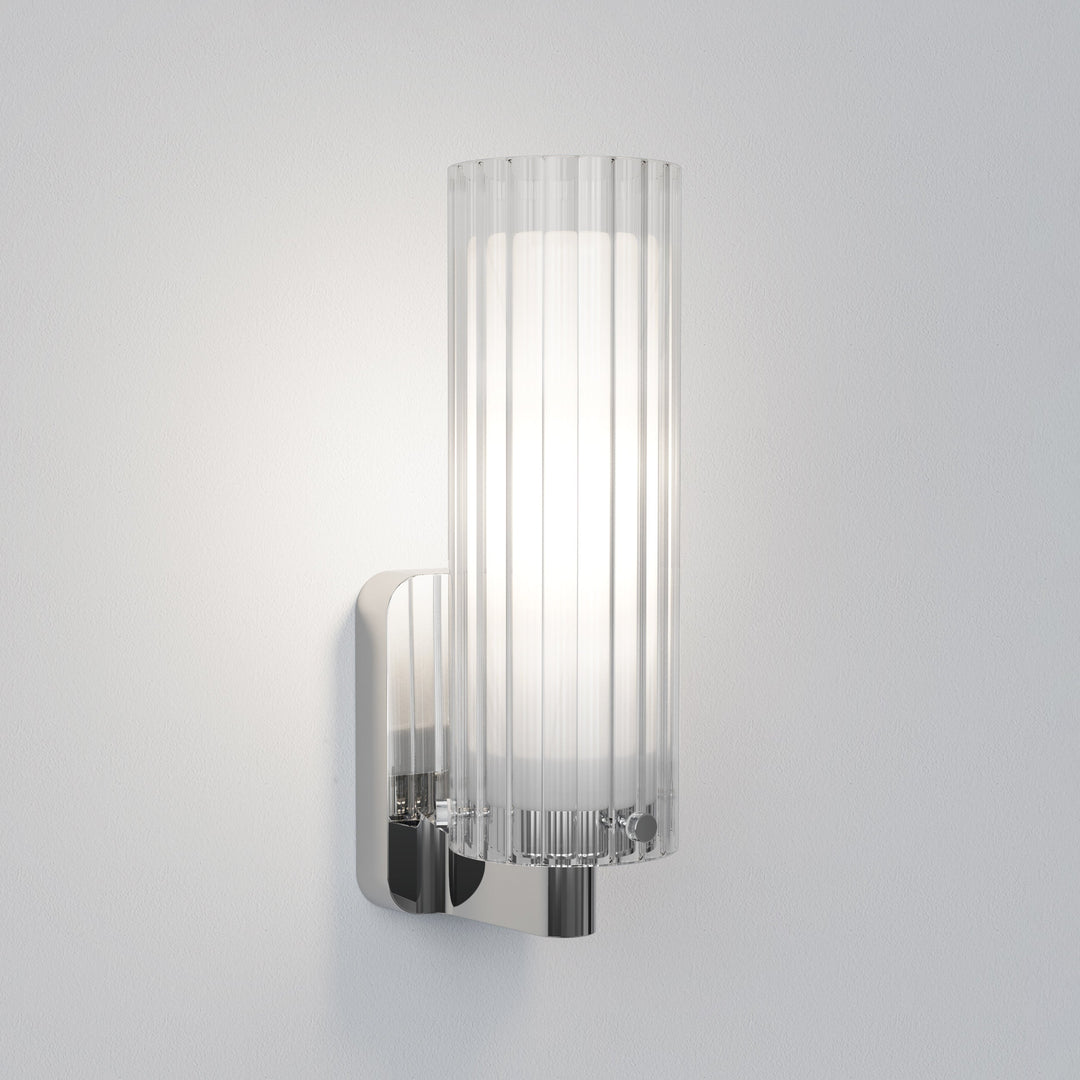Pair of Ottavino wall lights flanking a bathroom mirror in polished chrome