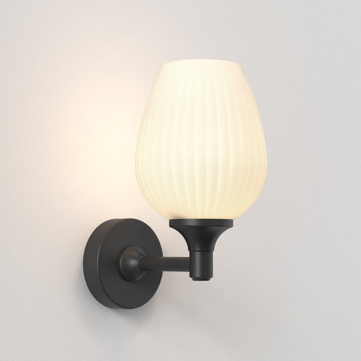 Astro Liberty Wall Light in Matt Black with ribbed glass shade