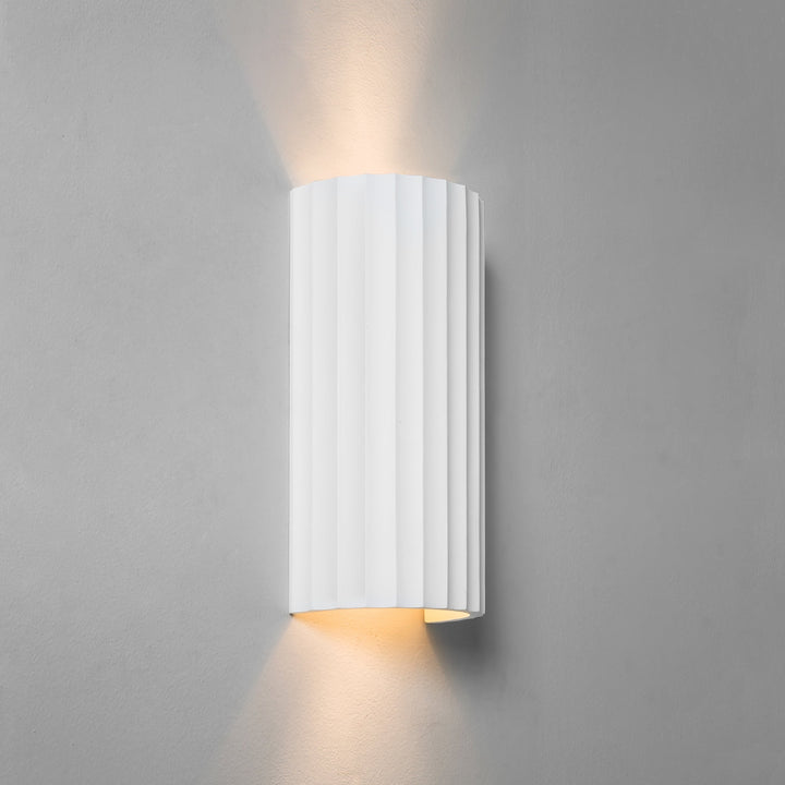 Astro Kymi 300 plaster wall light – ribbed cylinder casting uplight and downlight