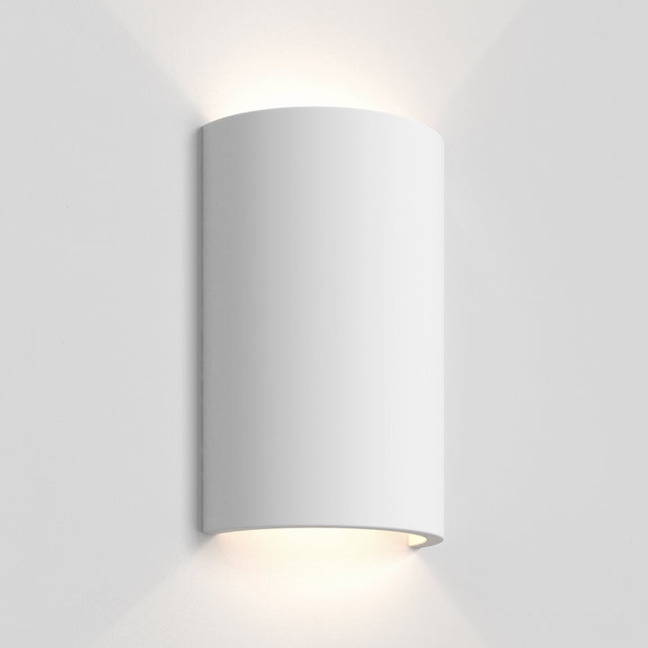 Close-up of Serifos 220’s curved plaster form, unpainted finish
