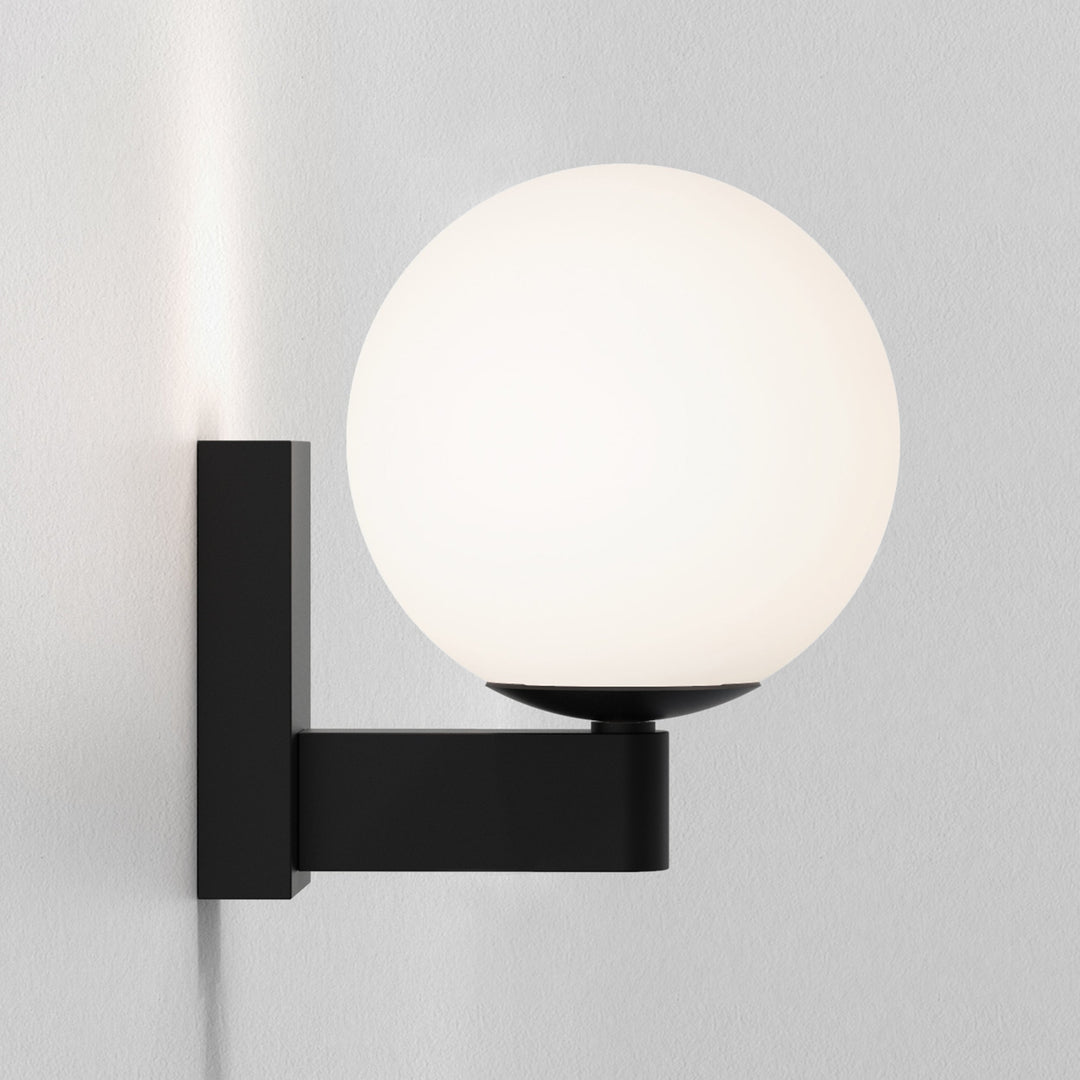 Close-up of the opal glass globe and zinc arm profile