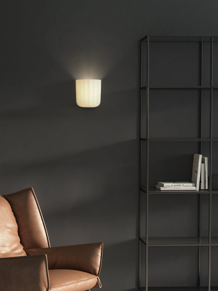 Veo wall light mounted, casting upwash on wall