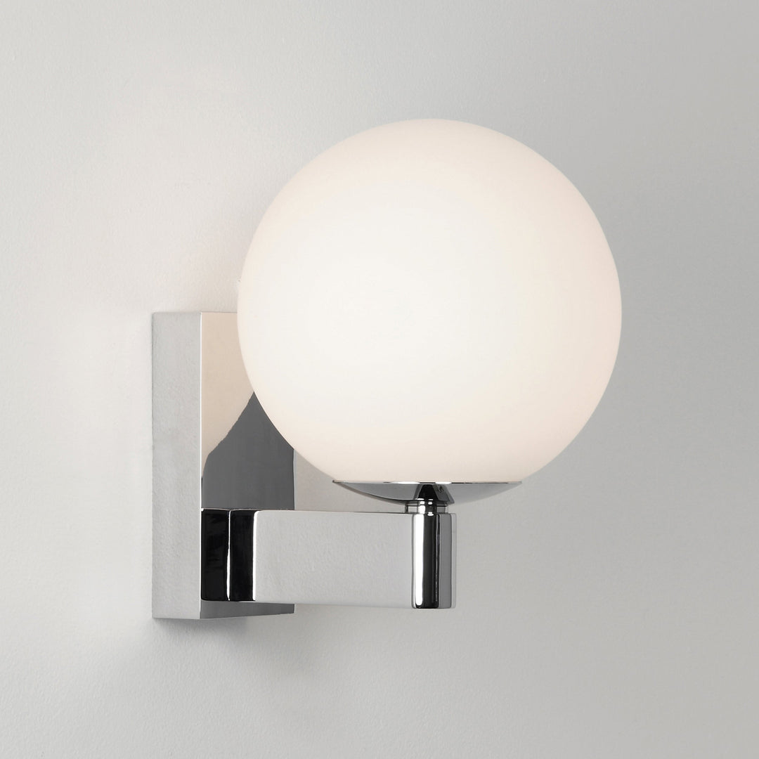 Astro Sagara wall light in Polished Chrome, showing spherical opal glass diffuser and angular arm