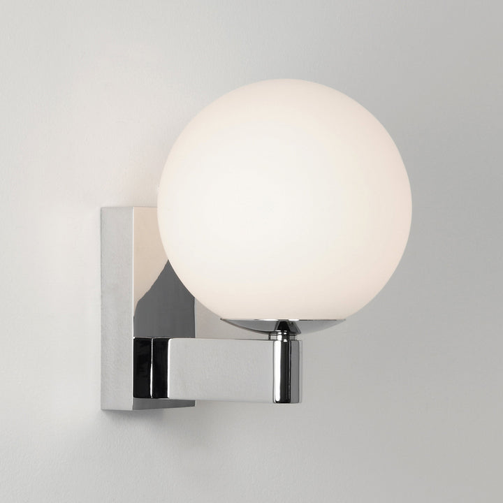 Astro Sagara wall light in Polished Chrome, showing spherical opal glass diffuser and angular arm