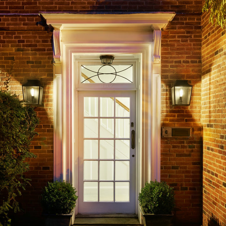 Richmond 285 mounted beside an entrance, casting warm ambient glow