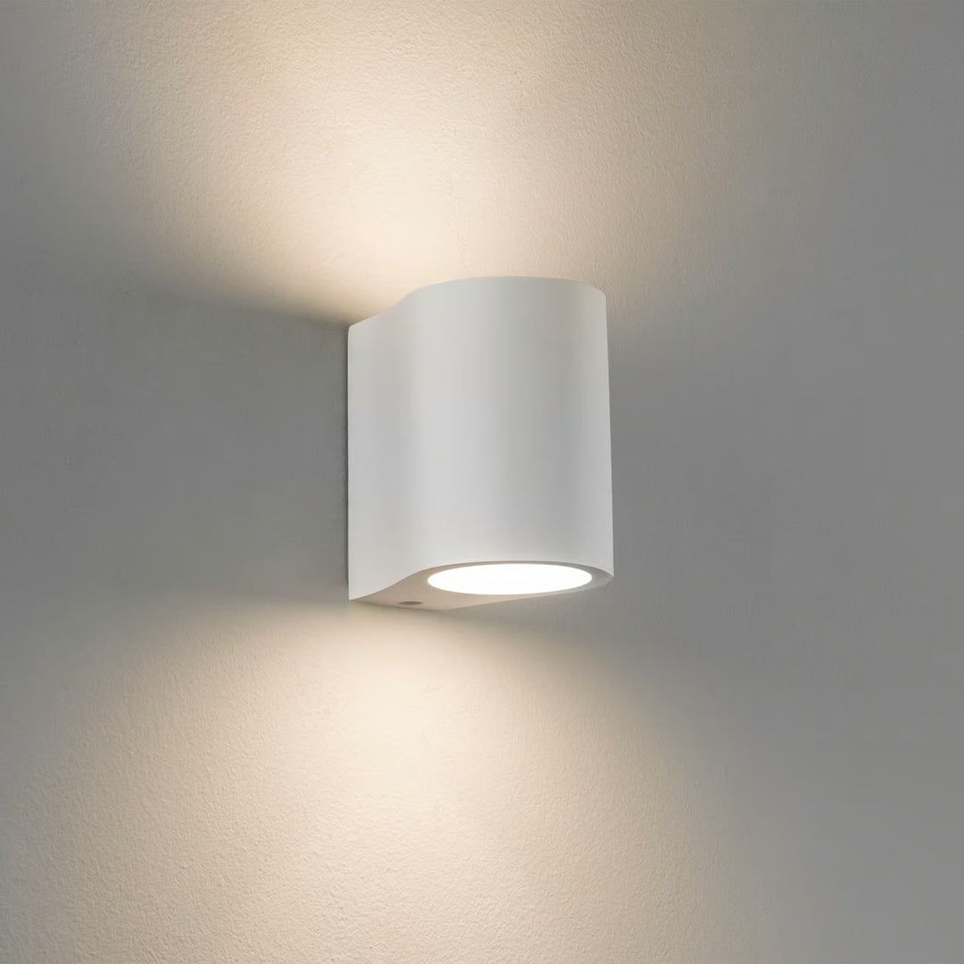 Astro Pero wall light in matt plaster, glowing softly up and down