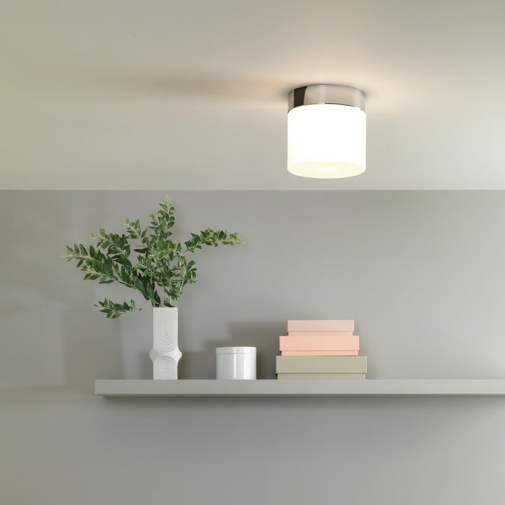 Sabina ceiling fixture installed in a bathroom setting, providing soft ambient light