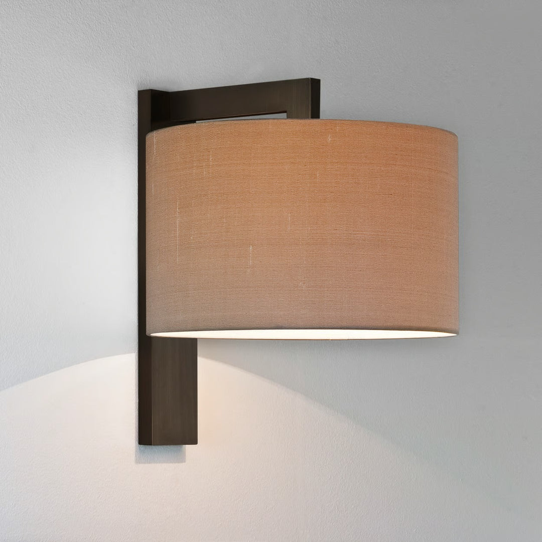 Close-up of Ravello’s bronze cantilever arm and fabric shade interface