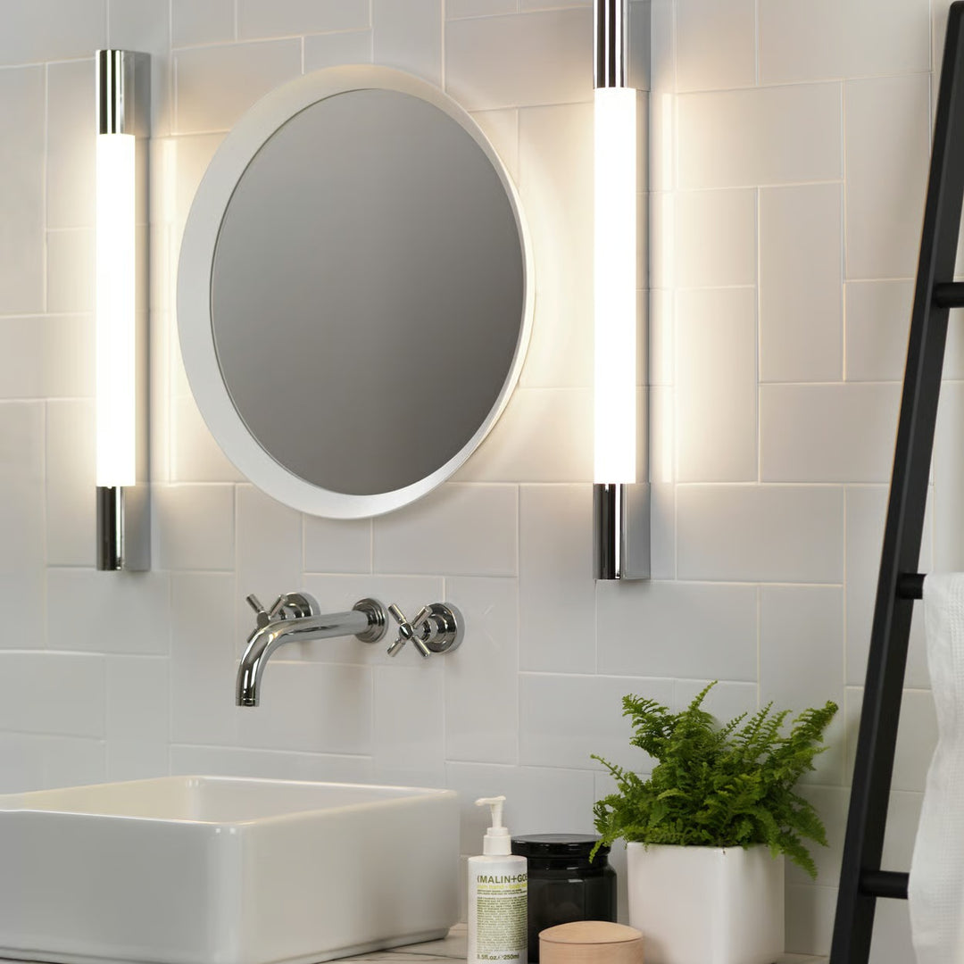 Palermo 600 LED installed on a bathroom wall, softly illuminating alongside a mirror