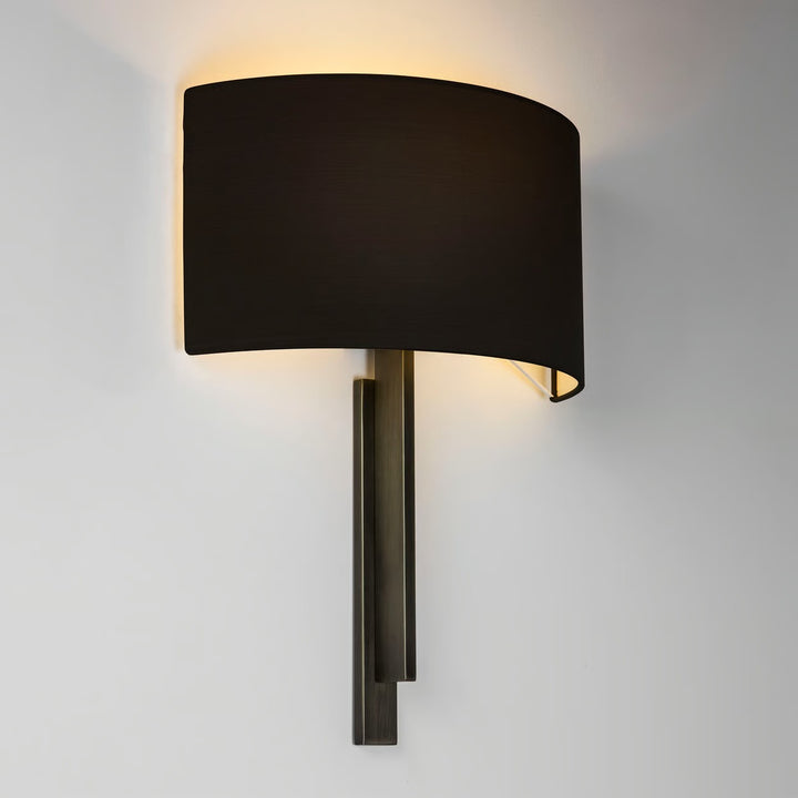 Astro Tate wall light in bronze, mounted vertically with semi-circular shade