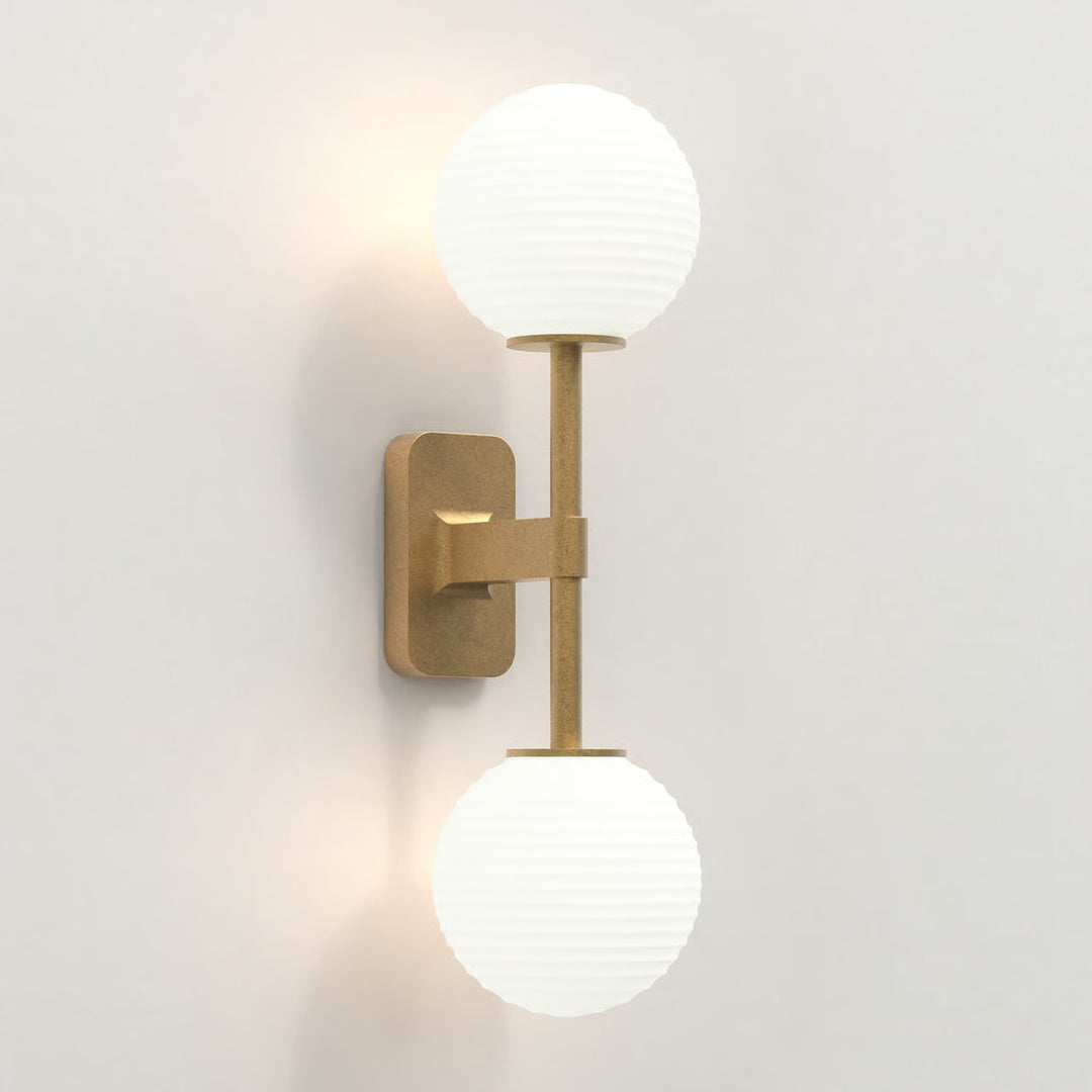 Antique Brass finish showing both arms and detailed wall bracket