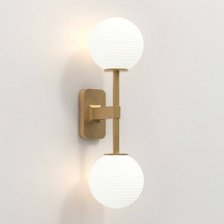 Antique Brass finish showing both arms and detailed wall bracket