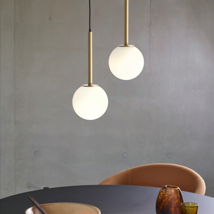 Stylish vignette: suspended pendant over dining table or bar area