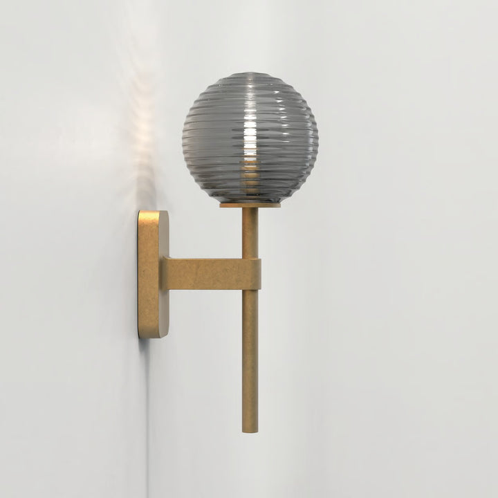 Astro Tacoma Single wall light in Antique Brass with ribbed glass shade