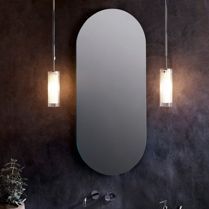 Close-up of ribbed glass cylinder on the Astro Ottavino pendant, polished chrome canopy