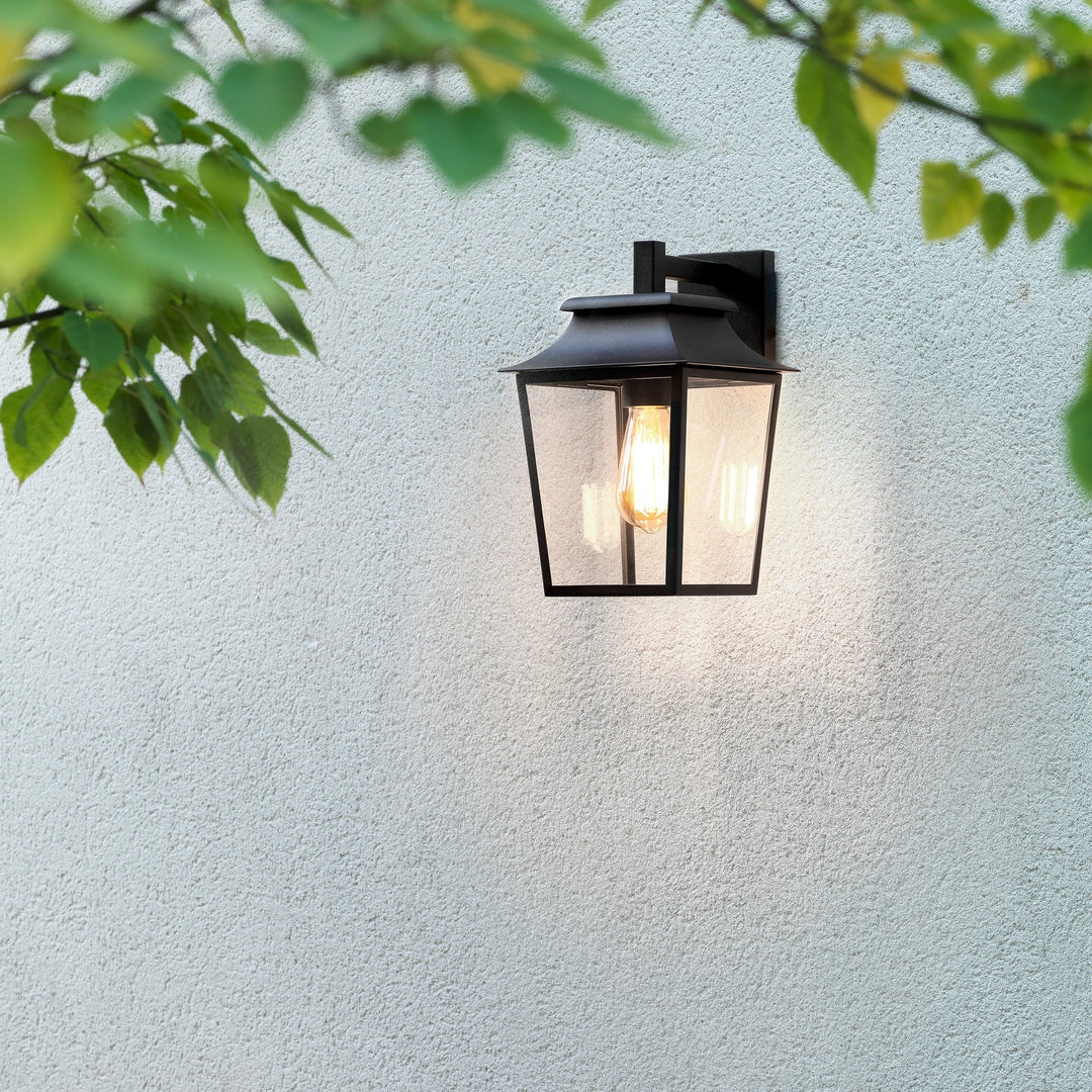 Lantern installed next to a doorway, softly illuminating the wall