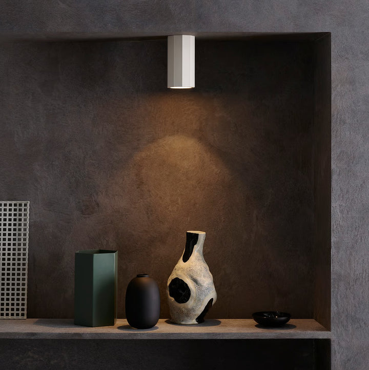 Installed view of the Shadow Surface 150 on a ceiling, directing soft ambient downlighting